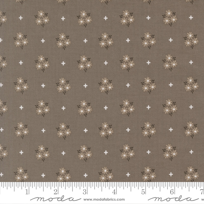 Slate background fabric with gray and white flowers and white plus signs.