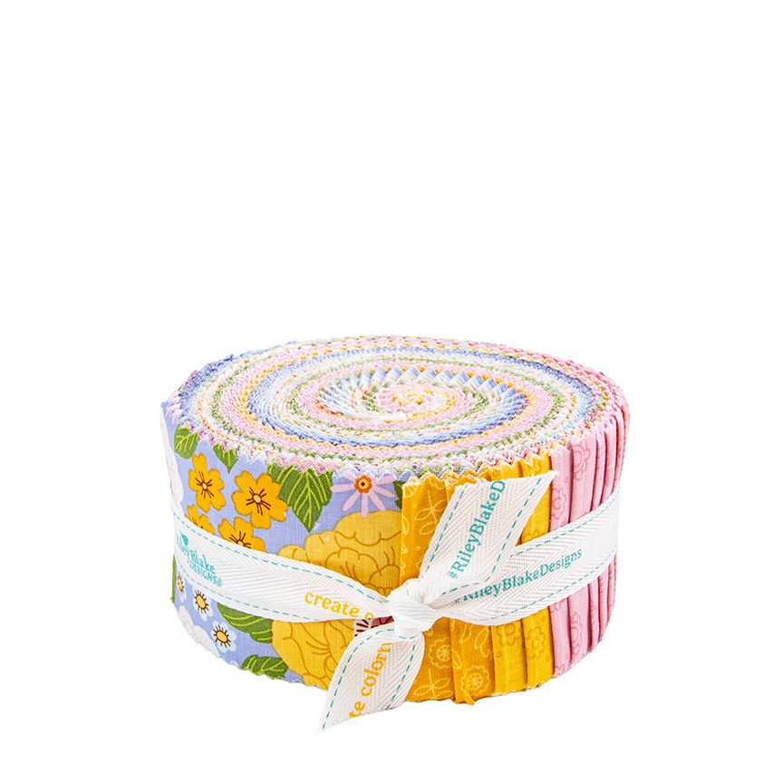 A rolled bundle of fabric pieces tied with a white ribbon, showing a multicolor floral and pastel pattern on a plain white background.