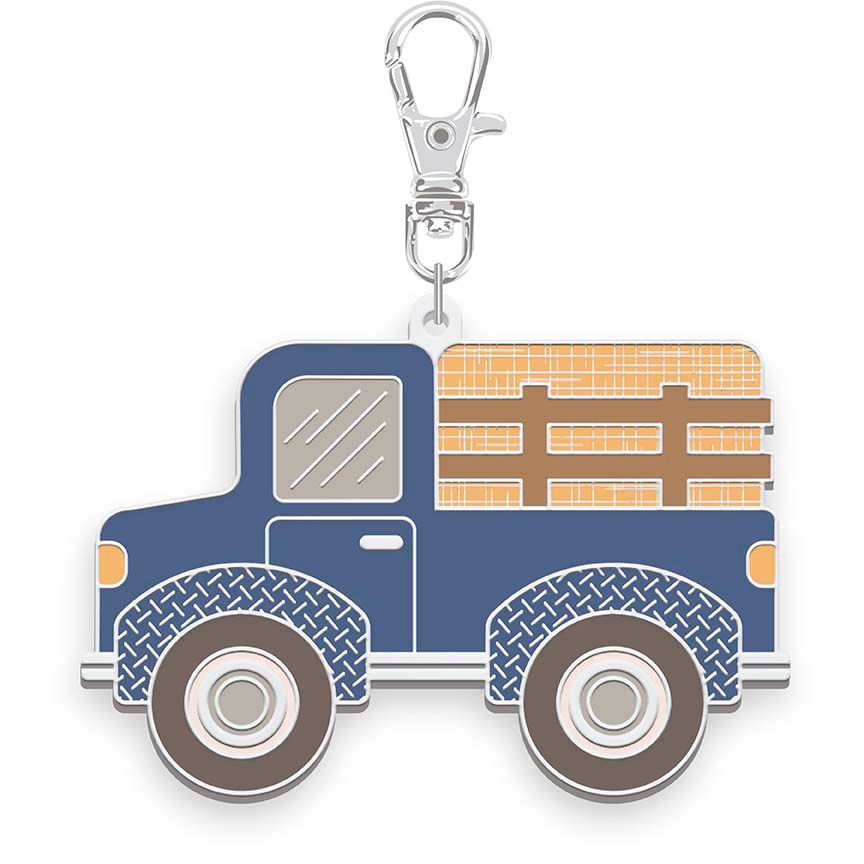 Blue truck-shaped keychain with a silver clasp on a white background