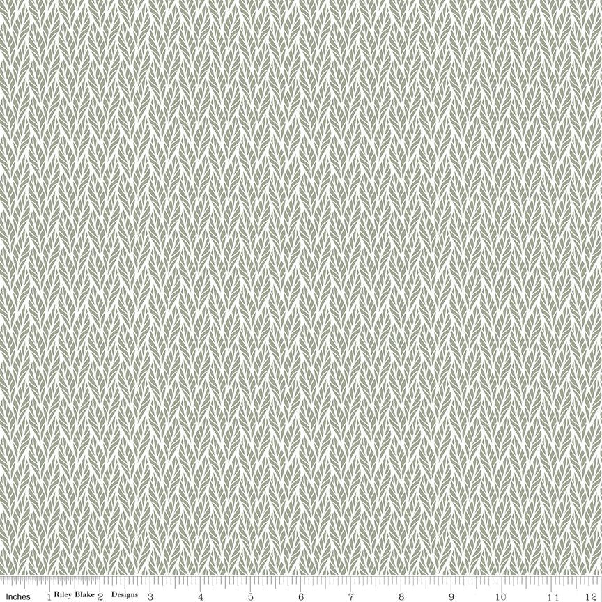 Cream fabric with a subtle leaf texture and a white ruler along the bottom edge showing measurements.