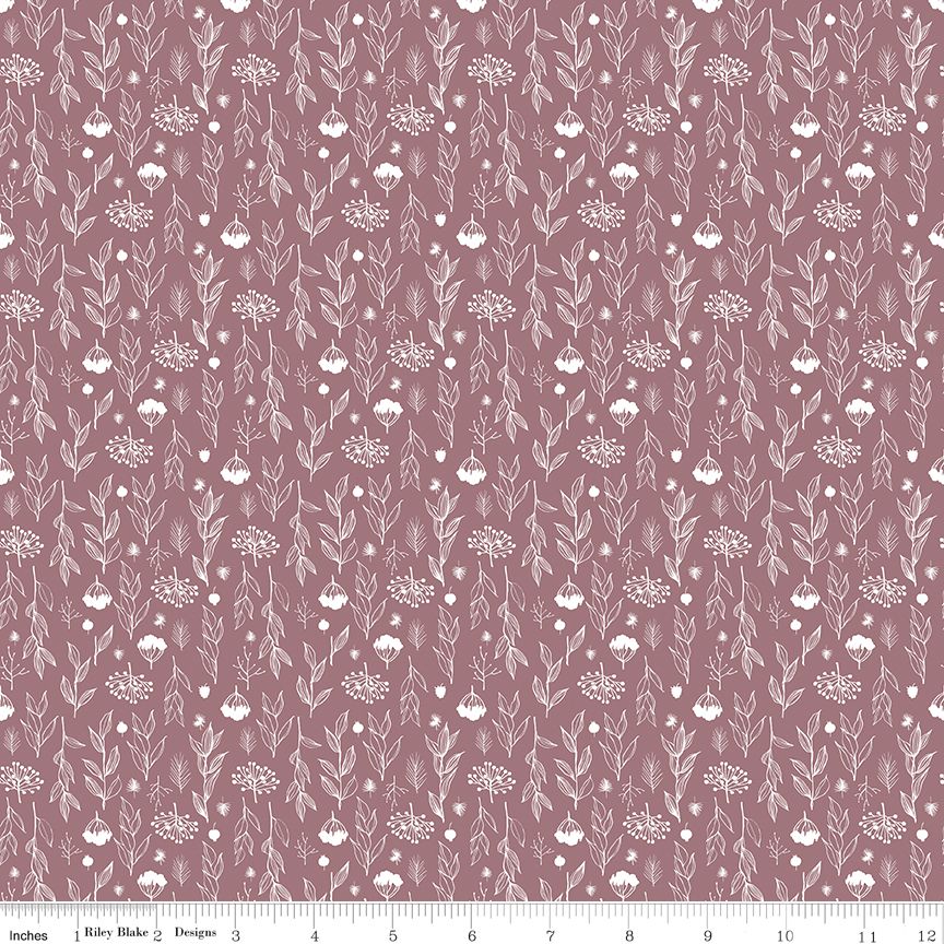 A repeating floral and botanical pattern in white on a dusty mauve background, shown as a fabric swatch with a ruler along the bottom edge.