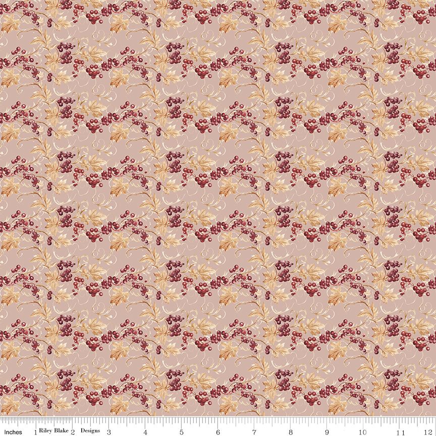A repeating pattern of berries and leaves on a dusty pink background, featuring cream-colored leaves and stems with clusters of dark red berries. A white ruler with inch markings is visible along the bottom edge, indicating scale.