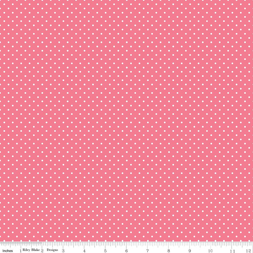 Pink fabric with small white polka dots