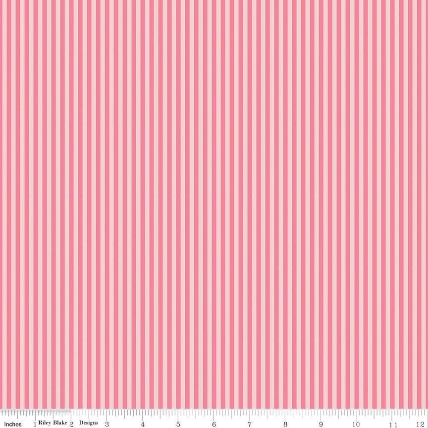 Pink tonal vertical striped fabric pattern shown flat, with a ruler along the bottom edge for scale.