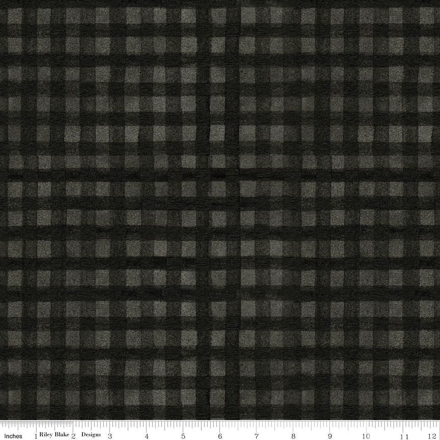 Black and gray buffalo check fabric pattern shown flat with a ruler along the bottom edge for scale.