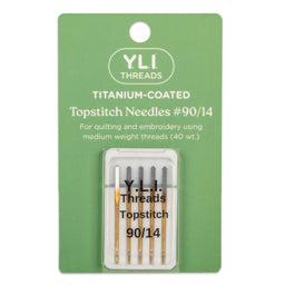 YLI Threads Titanium-Coated Topstitch Needles #90/14 in a green retail card package with a clear plastic case containing four needles.