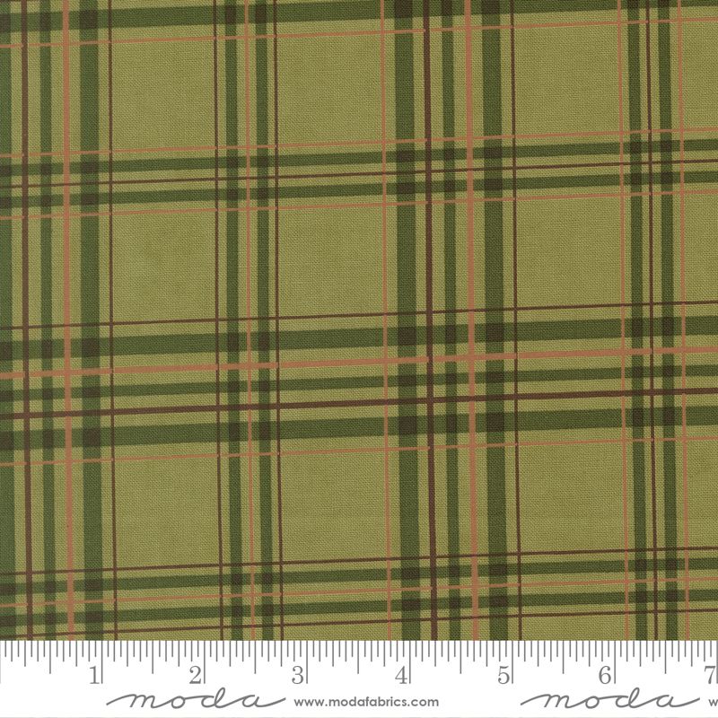 Green plaid fabric with a ruler for scale, featuring the Moda Fabrics logo.