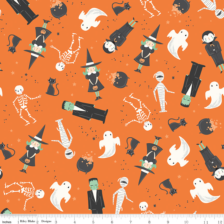 Halloween-themed fabric with ghosts, skeletons, witches, frankenstein, and other characters on an orange background.