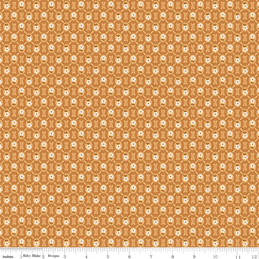 Orange fabric with white flowers in ovals in a tiled pattern.