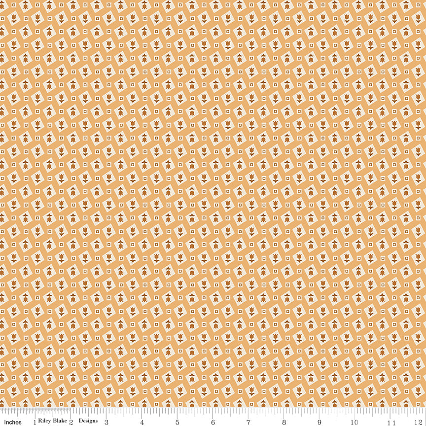 Yellow fabric with tulips in cream diamonds and squares.