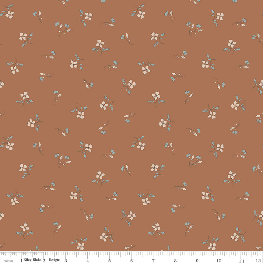 Red fabric with scattered sprigs of flowers and leaves.