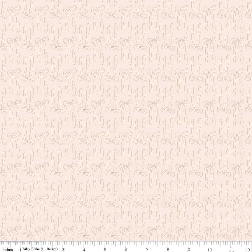 Tan fabric with line-drawn bows.