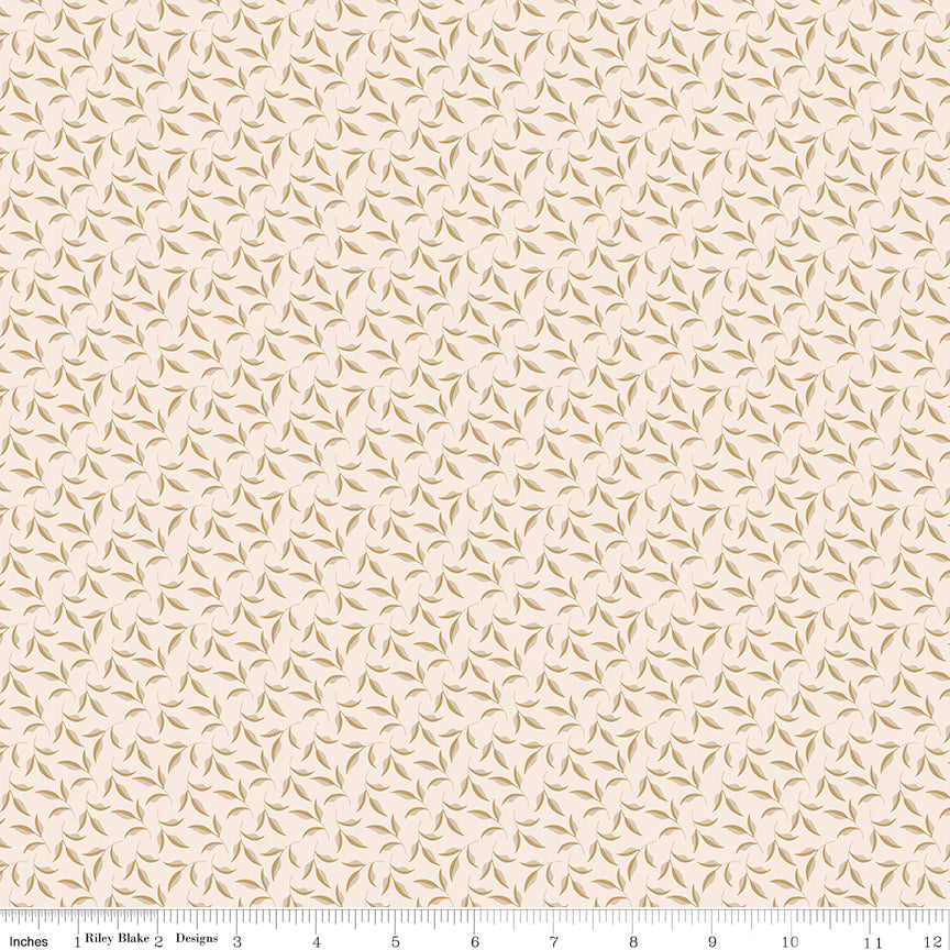 Tan fabric with sprigs of leaves.