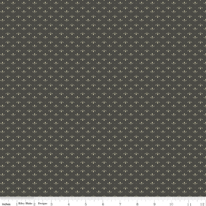 Gray fabric with an array of blossoms and pin dots.