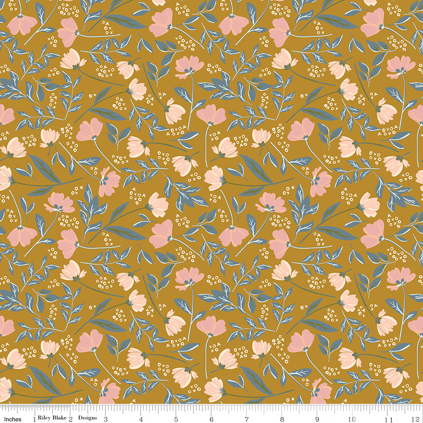 Orange fabric with sprigs of flowers and leaves with X's and O's.