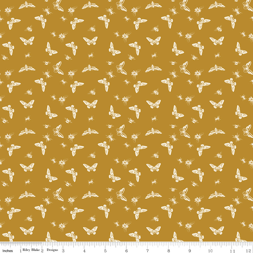 Orange fabric with little winged bugs.