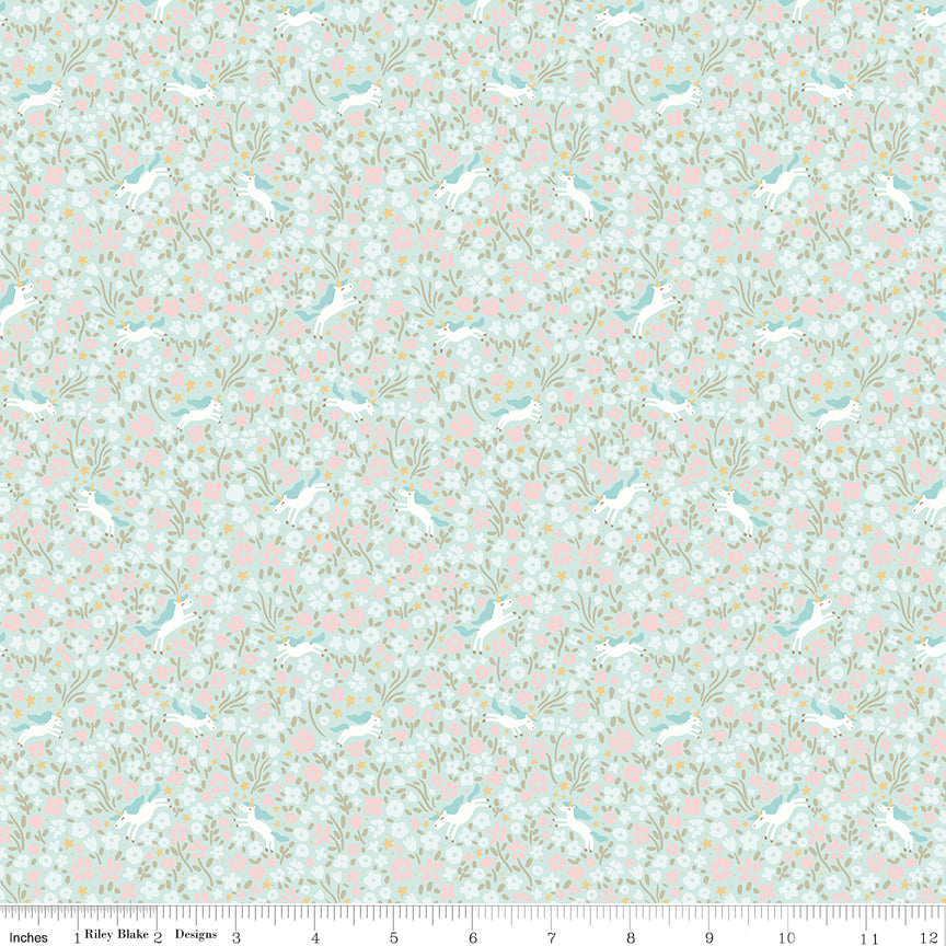 Aqua fabric with unicorns surrounded by flowers.