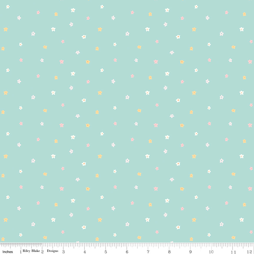 Teal fabric with scattered little blossoms.