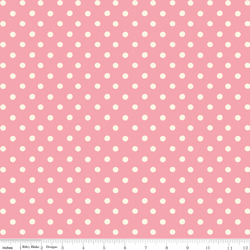 Pink fabric swatch with white polka dots.