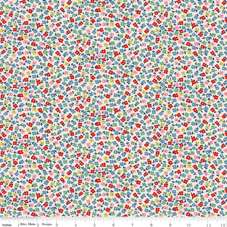 Tiny red, blue, green, yellow and pink flowers on a cream background.