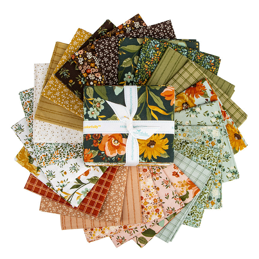 Worth Repeating Fabric Collection by Sandy Gervais for Riley Blake Designs.  Fabrics from collection fanned out. 