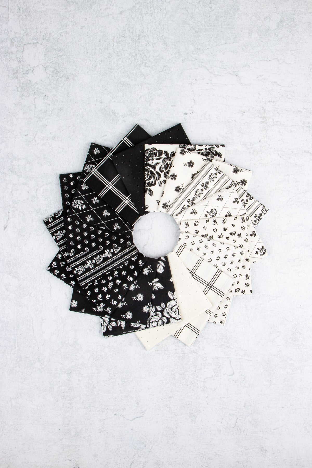 Moonlit Trellis by My Mind's Eye fabric collection showing black and white floral, grid, and stripe quilting prints