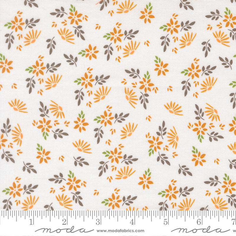 White fabric with orange flowers and gray, green, and orange leaves.