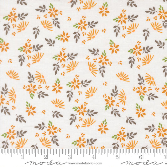 White fabric with orange flowers and gray, green, and orange leaves.
