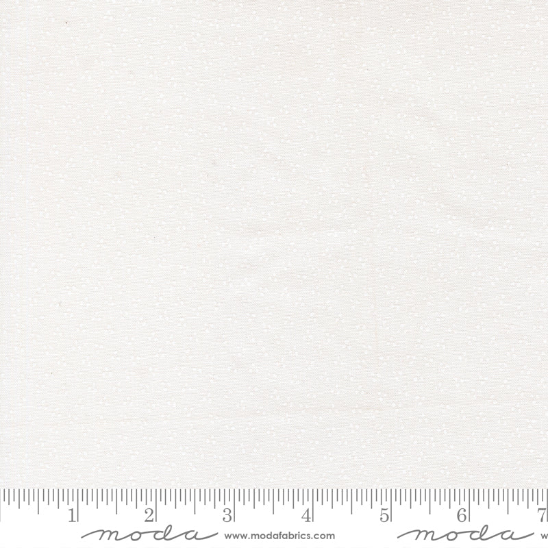 Fabric swatch with tiny white dots on a white background.  