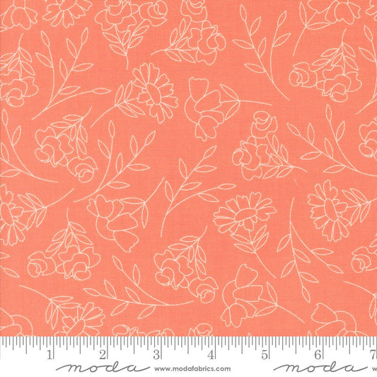 Coral pink fabric with a white floral line pattern, shown flat with a measuring ruler along the bottom edge.