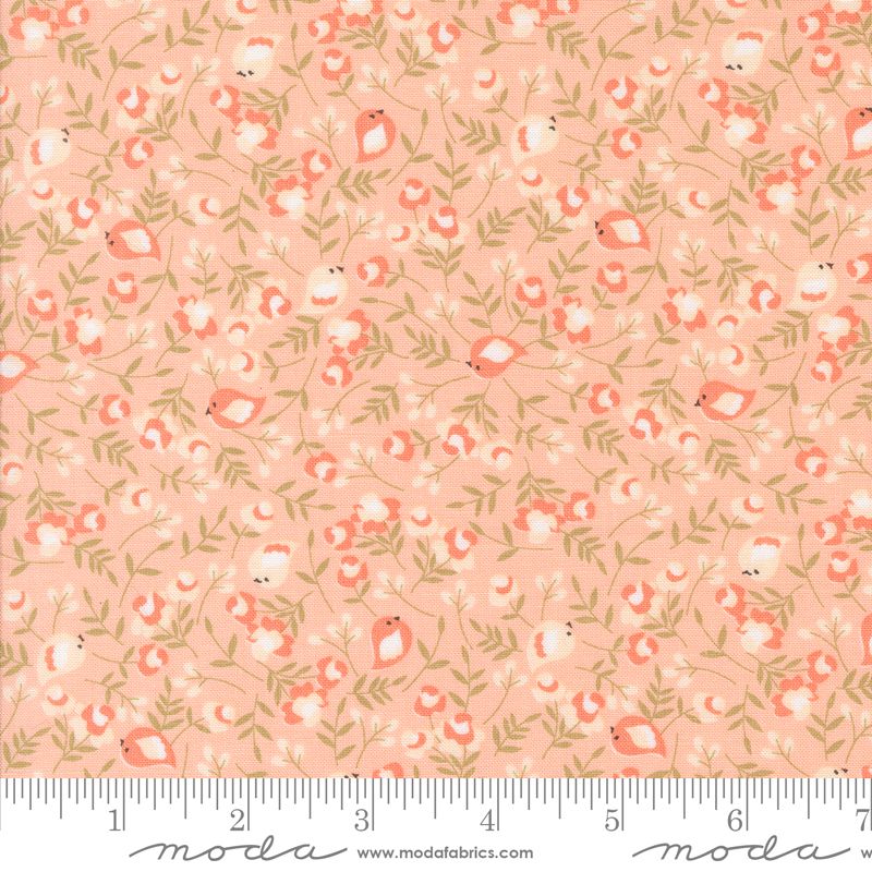 A repeating fabric pattern featuring small  birds, coral flowers, and olive green leaves on a peach background, with a ruler and Moda Fabrics branding along the bottom edge.