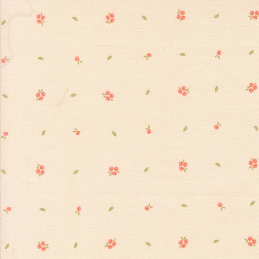 A close-up of a cream-colored fabric with a delicate repeating pattern of small pink flowers and tiny green leaves.