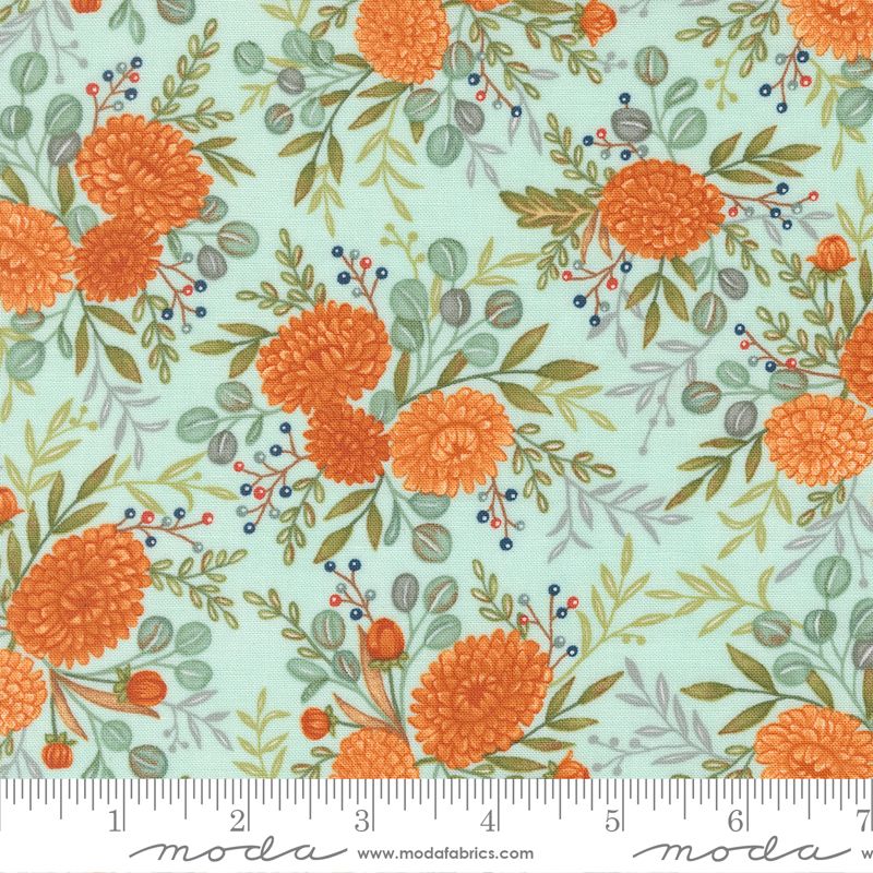 Floral pattern with orange flowers and green leaves on a light blue background