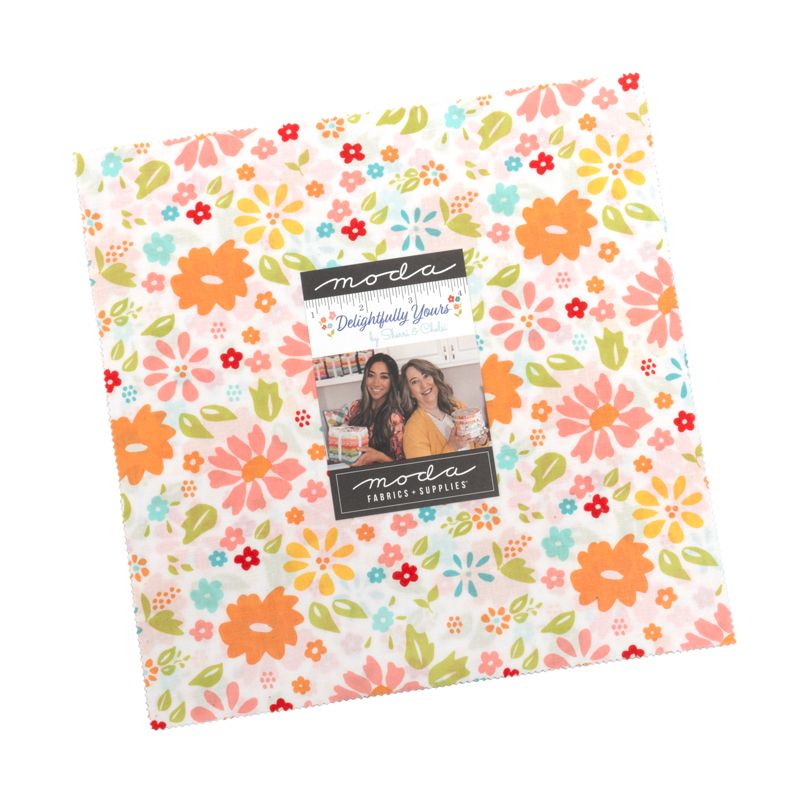 Floral patterned layer cake with Moda label on a white background