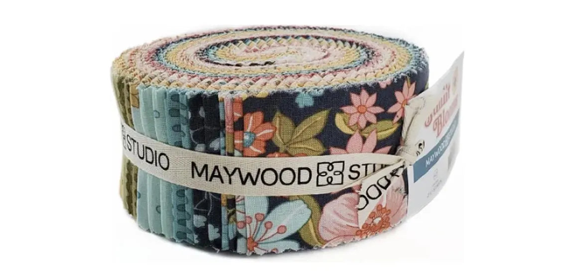 A roll of Maywood Studio cotton fabric with a multicolor floral and paisley pattern, wrapped in a white paper band.