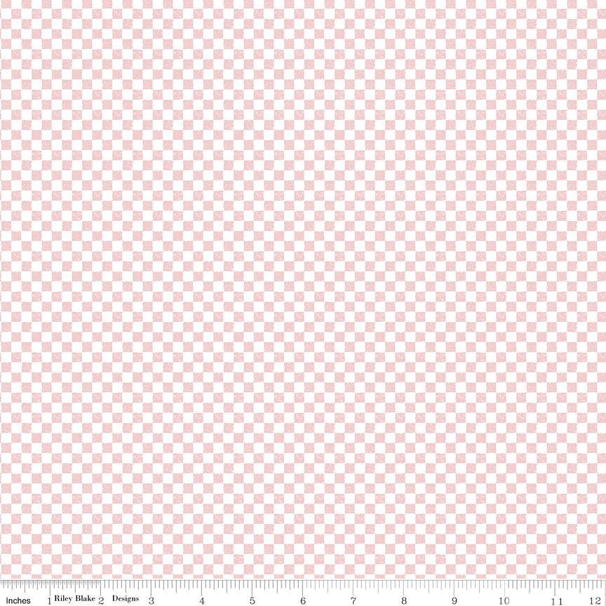 Pink and white checkered fabric with a ruler for scale.