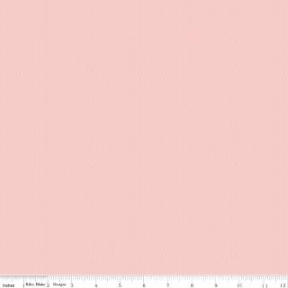 Solid light pink fabric texture with a ruler at the bottom for scale.