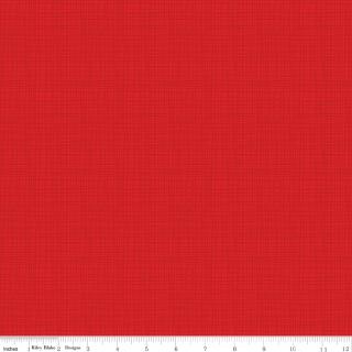 A close-up of a red fabric texture with a fine woven grid pattern, with a white ruler visible along the bottom edge.