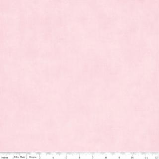 A close-up of a light pink textured fabric with a white ruler along the bottom edge showing measurement markings.