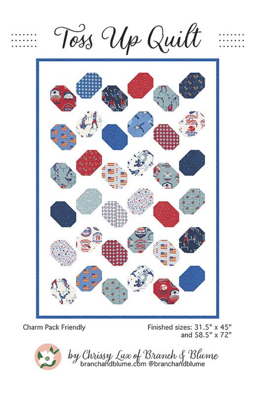 Hexagonal quilt pattern with various colorful fabric pieces on a white background