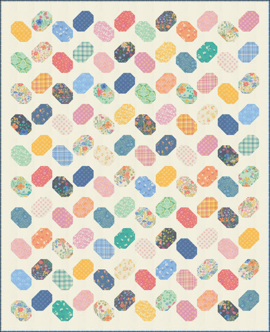 A quilt featuring a repeating pattern of hexagonal and oval patches in various colors and prints, including florals, stripes, and plaid, arranged in rows on a cream background.
