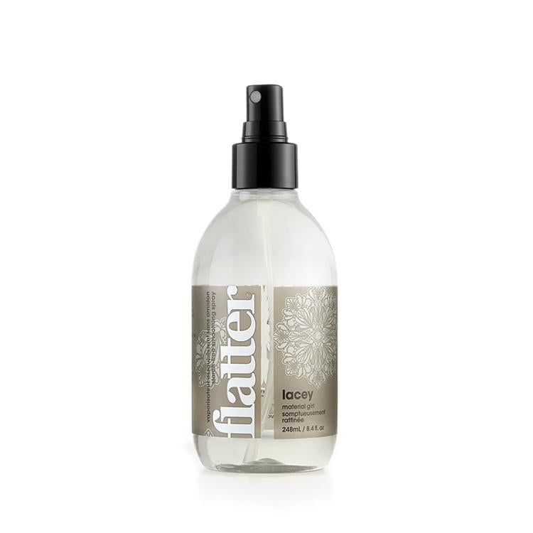 Bottle of flatter lacey scent smoothing spray product on a white background