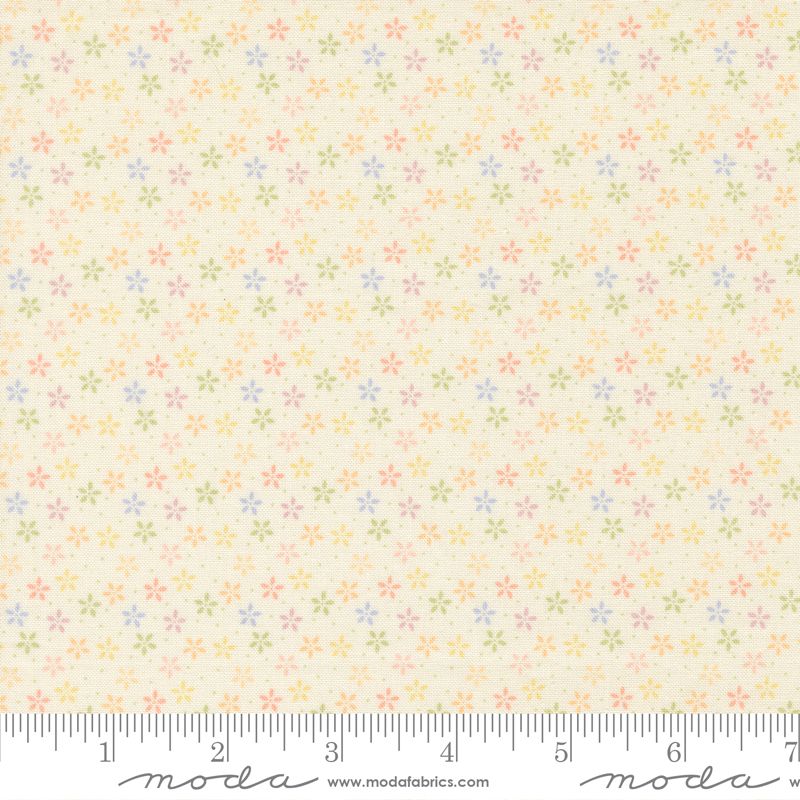 Floral pattern fabric with a ruler at the bottom for scale on a cream background