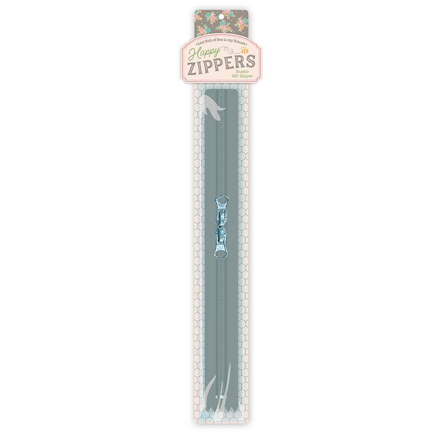 A packaged set of two long zipper teeth in a muted sage green color with a small light blue decorative accent, shown in its retail blister pack with a floral header card reading 'Penny for a Zippers'.
