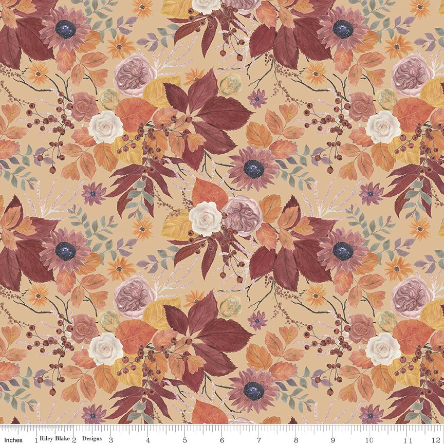A repeating floral pattern on a warm beige background with large leaves and flowers in rust red, orange, mauve, cream, and muted blue-green. A white ruler along the bottom edge shows measurements in inches.