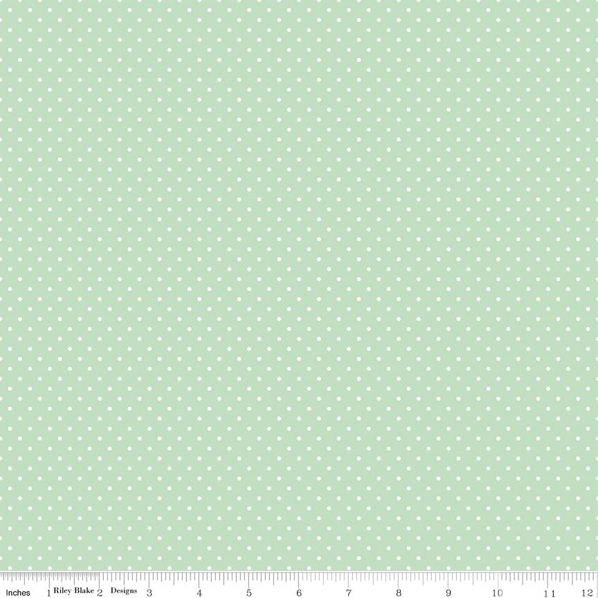 White dots on a light mint background