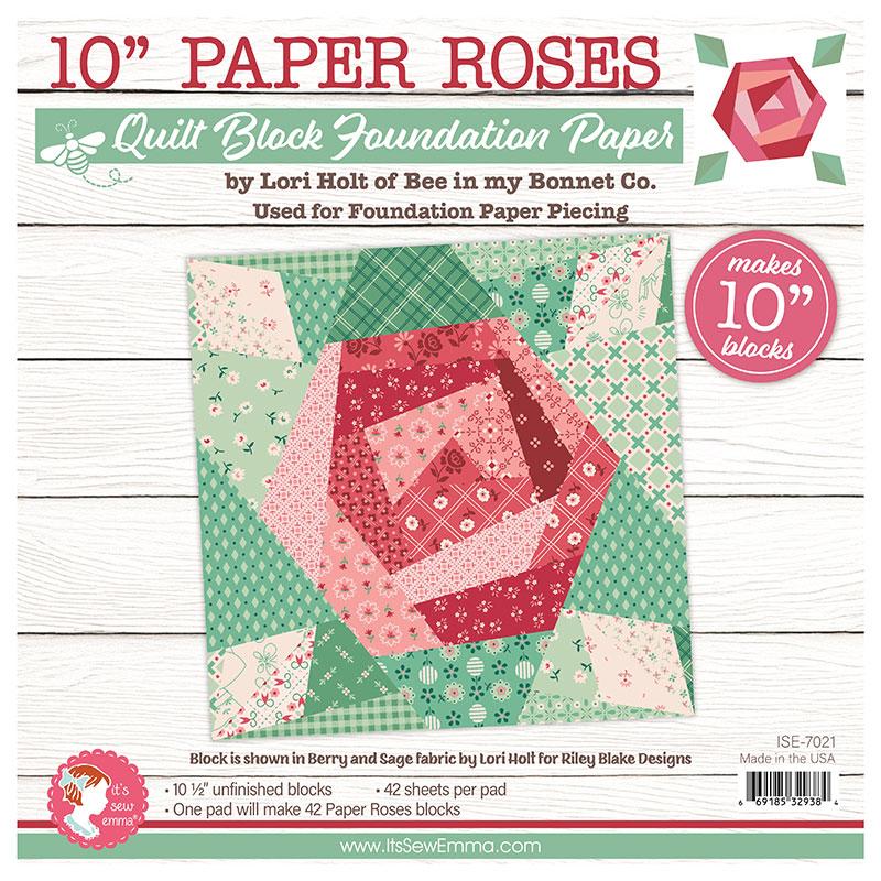 Quilt block foundation paper packaging with a paper rose design on a wooden surface