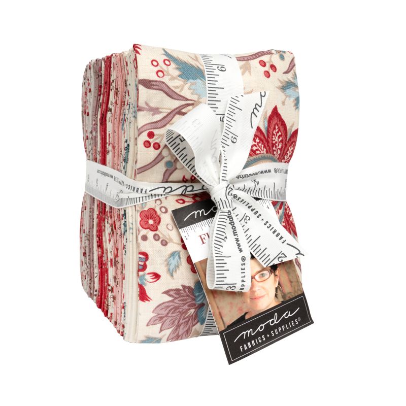 A colorful fat eighth bundle with a ruler and Moda label on a white background