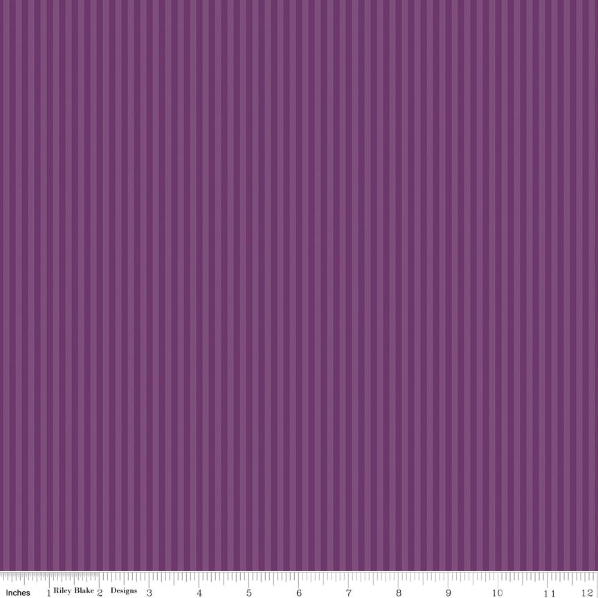 Tonal dark and light purple stripes with a ruler at the bottom for scale.