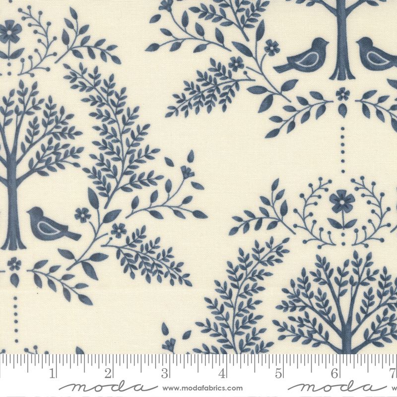 Fabric pattern with blue trees, branches, and birds on a white background, featuring Moda label.